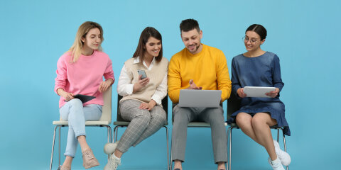 People waiting for job interview on light blue background